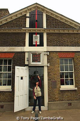 Astride the Prime Meridian, under the Millennium Clock 