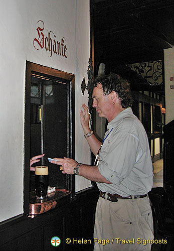 The bartender appears at this hole in the wall and serves you your beer[Bamberg - Main & Danube River Cruise - Germany]