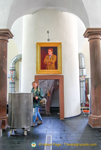 Tony in the Fürst Löwenstein winery. Portrait is of Prince Carl Friedrich zu Löwenstein, who died in a racing championship in 2010.