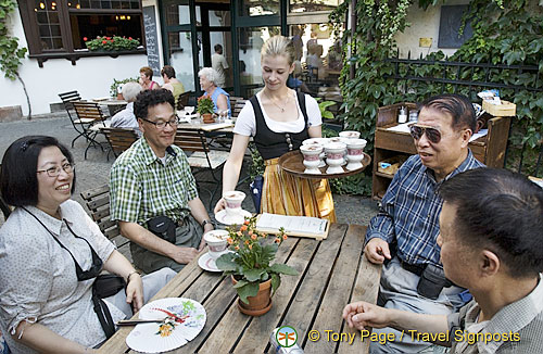 The Canadian team being served their Asbach[Rudesheim - Rhine River Cruise - Germany]