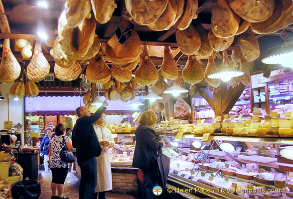 Legs of Parma ham decorate the ceiling of La Baita