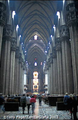 The aisles are divided by giant pillars and lit from all sides by excellent stained glass
[Duomo - Milan - Italy]