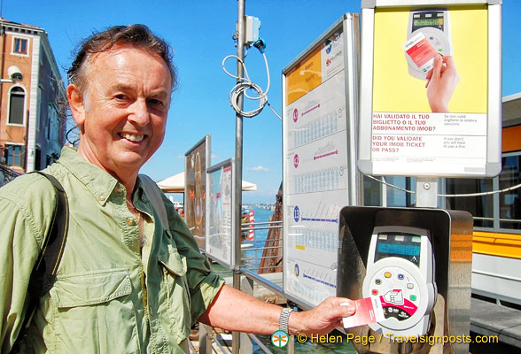 Tony validating his vaporetto ticket before boarding the boat