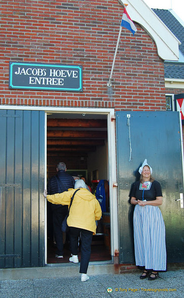 Dressed in traditional Volendam costume, our host welcomes us to their cheese farm