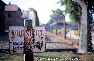 A camp fence sign warning against high voltage