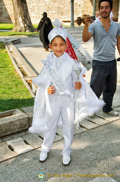 A little boy celebrating his circumcision