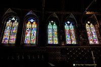 The stained glass show scenes of the sovereigns of Flanders