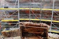 The scene behind the scaffolding shows the Duke of Wellington and his staff