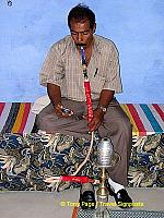 Smoking a water pipe.

Aswan - Nile River - Egypt