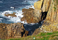 Dramatic plunging cliffs and crashing waves