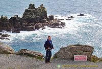 Tony at the dangerous cliff sign