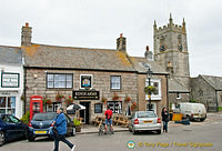 The Kings Arms with St Just Church next door