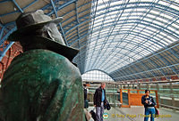 Sir John Betjeman marvelling at the roof of St Pancras