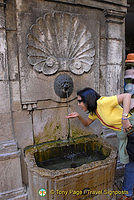 Drinking off a water fountain in Annecy