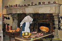 Gothic fireplace with a dual hearth and mechanical spit