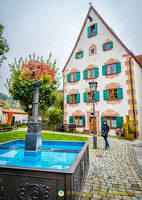 Fountain and trompe l'oeil building