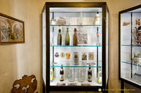 Display case of beer bottles and mugs