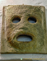 Wall tile shaped like a mask