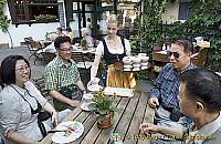 The Canadian team being served their Asbach[Rudesheim - Rhine River Cruise - Germany]