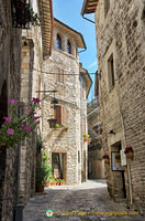 Medieval cobbled street leading to Rocca Maggiore