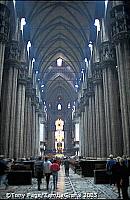 The aisles are divided by giant pillars and lit from all sides by excellent stained glass
[Duomo - Milan - Italy]