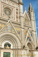 At the centre of the rose window is the head of Christ