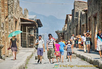 Pompeii street with Vesuvius in the background