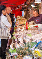 Intense looks of restaurant chefs doing their seafood purchases