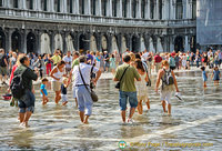 Tourist having a bit of fun in the flood water