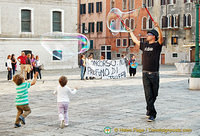 Little kids taken by the bubbles