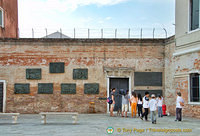 Seven wall plaques depicting deportation, Kristalnacht, the quarry, punishment, execution, the Warsaw Uprising, and the final solution