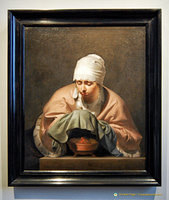 A Young Woman Warming her Hands over a Brazier is an allegory of winter