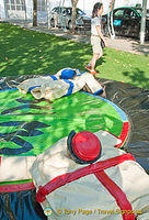 These people were doing sumo-wrestling in the park