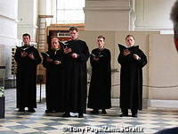 Priests performing for visitors