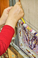 Very fine silk carpet being woven