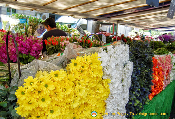 Impressive wall of flowers at Marché Président Wilson 