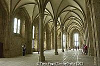 The rib vaults and finely decorated capitals are typically Gothic, Mont-St-Michel [Mont-St-Michel - France]