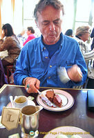 Tony digging into his chocolate macaron